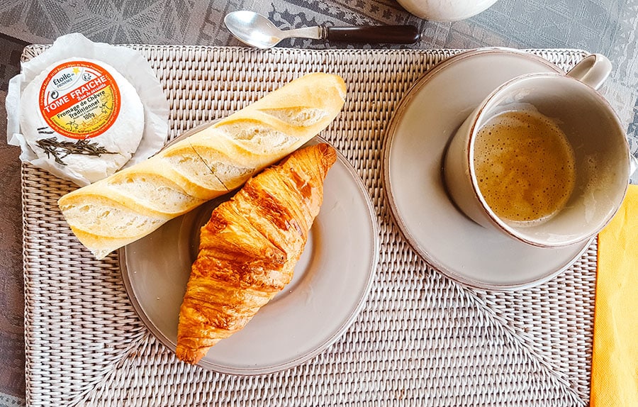 A baguette, croissant and goat's cheese