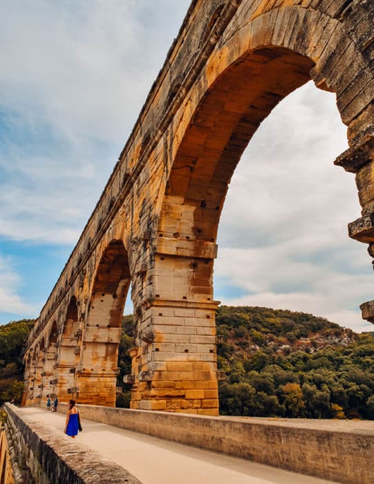 Walking across the magnificent Pont du Gard aqueduct