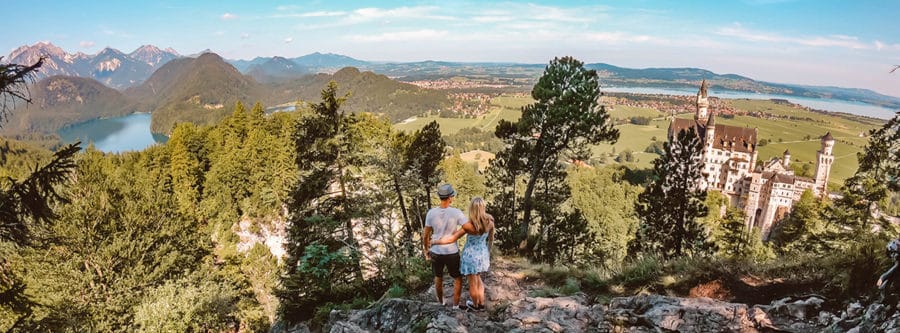 An epic view of Neuschwanstein Castle and surrounding countryside