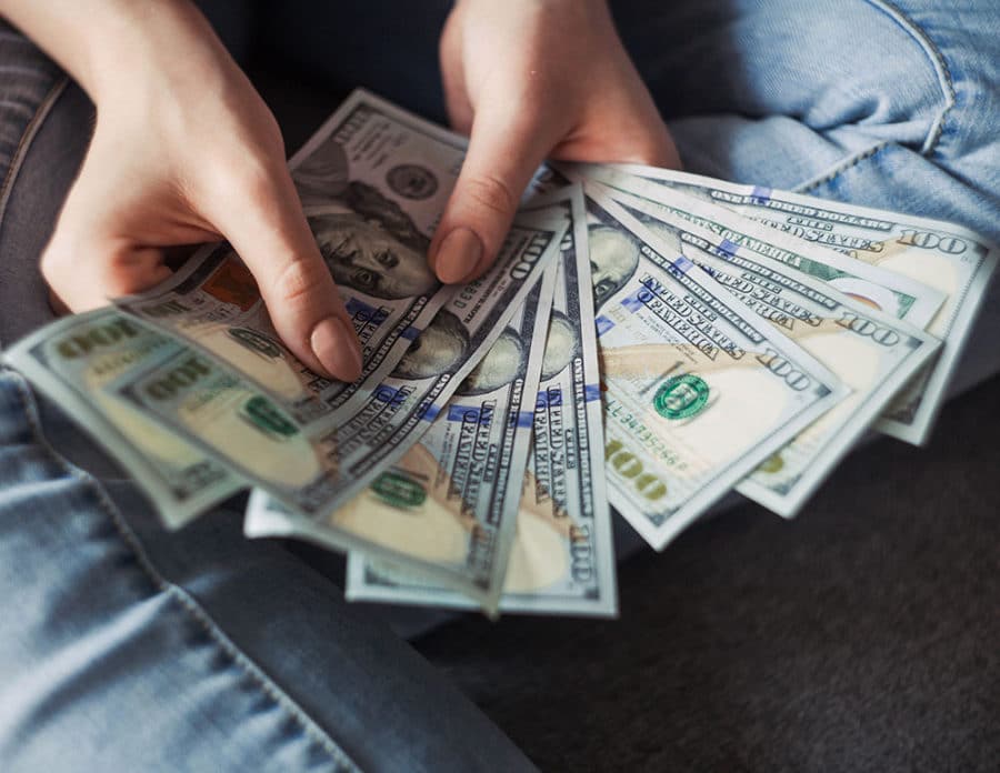 A woman holding money