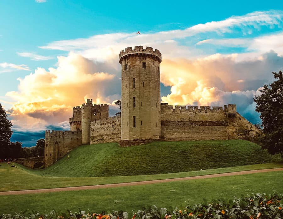 A beautiful view of Warwick Castle at sunset